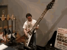 Dude Rocks A Huge Guitar GIF - Huge Guitar Rock GIFs