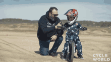 fist bump teaching riding bike kid