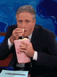 Eating Popcorn GIF - Eating Popcorn Daily Show GIFs