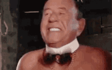 Frank Butcher Spinning GIF - Frank Butcher Spinning Bow Tie GIFs