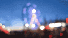 ferris wheel amusement ride amusement park lights blurry