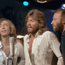 Singing Barry Gibb GIF - Singing Barry Gibb Robin Gibb GIFs