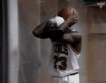 holding a basketball michael jordan mj jordan chicago bulls