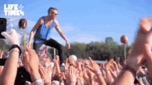 Crowd Standing Fist Pump GIF - Life And Times Macklemore Crowd GIFs