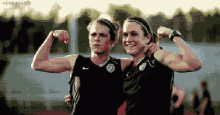 soccer players girls posing biceps two girls