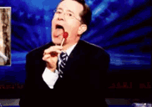 Colbert Lollipop GIF - Stephen Colbert Lollipop Licking GIFs