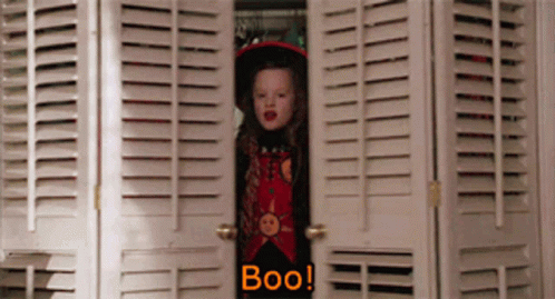 gif of Dani from hocus pocus throwing her arms up and yelling boo