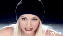 Gwen Stefani Cover Mouth GIF - Gwen Stefani Cover Mouth Looking Around GIFs