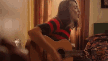 Playing Guitar Evie Irie GIF - Playing Guitar Evie Irie The Optimist GIFs