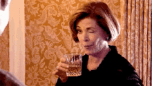 Lucille GIF - Wink Lucille Bluth Arrested Development GIFs