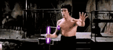 Bruce Lee Light Saber GIF - Bruce Lee Light Saber Fight GIFs