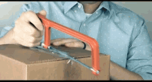 Opening The Box Using Hacksaw Opening Box GIF - Opening The Box Using Hacksaw Opening Box Unboxing GIFs