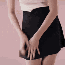 Angele Short Skirt GIF - Angele Short Skirt Pushing Down GIFs