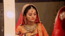 swaragini hellyshah swara maheshwari bridal orange lehenga