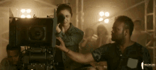 camera woman taking videos artistic director shoot camera woman taking videos artistic director shoot