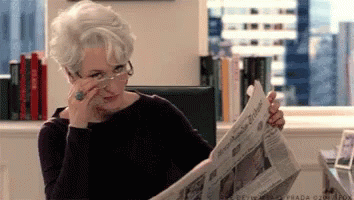 Meryl Streep as Miranda Priestly in The Devil wears Prada, whipping off her glasses and giving a knowing look
