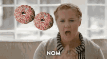 Donuts Amy Schumer GIF - Donuts Amy Schumer Nom Nom Nom GIFs