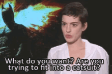 Anne Hathaway What Do You Want GIF - Anne Hathaway What Do You Want Are You Trying To Fit Into A Catsuit GIFs