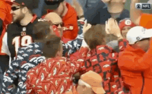 broncos denver broncos fans cheer fans in ugly jackets celebrate