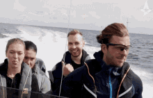 pointing gla1ve look at him smiling riding boat