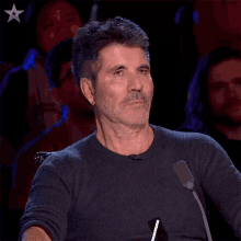 Suppressing Laughter Simon Cowell GIF - Suppressing Laughter Simon Cowell Britains Got Talent GIFs