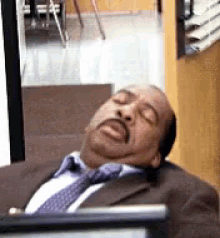 Gif of Leslie David Baker portraying a sleeping Stanley from The Office