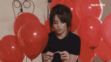 Camila Cabello Annoyed GIF - Camila Cabello Annoyed Balloons GIFs