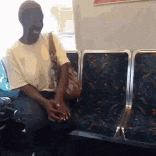 black-lady-talking-to-herself-on-subway-