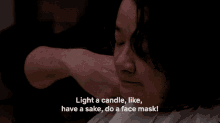 Light A Candle Have A Sake GIF - Light A Candle Have A Sake Do A Face Mask GIFs