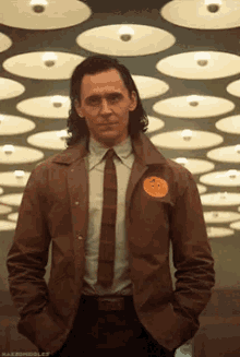 Gif of Loki from the MCU pointing at himself and winking.