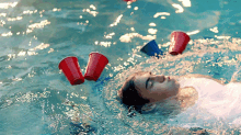 swimming in the pool cooling off summer plastic cups