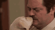 Ron Swanson Kisses Dog GIF - Parks And Recreation GIFs