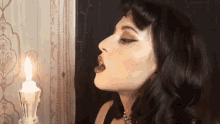 Blow The Candle Ashland GIF - Blow The Candle Ashland Santa Baby Song GIFs