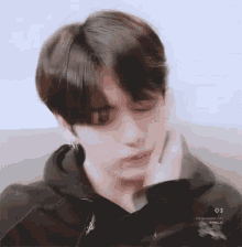 tired Jungkook slapping his face to stay awake