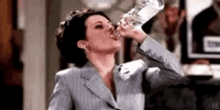 Megan Mullally Drinking GIF - Megan Mullally Drinking Will And Grace GIFs