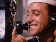 gene kelly anchors aweigh on the phone smiling gene kelly anchors aweigh on the phone smiling