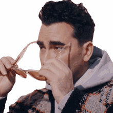 putting glasses dan levy bustle wearing sunglasses putting on