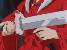inuyasha is putting the sword