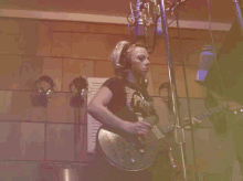 playing guitar recording studio plucking the band