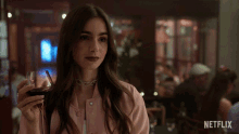 Smirk Lily Collins GIF - Smirk Lily Collins Emily Cooper GIFs