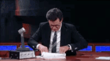 Looking Thru The Reciepts GIF - Evidence List Stephen Colbert GIFs