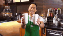 Barista Serving Two Coffees GIF - Coffee Starbucks Barista GIFs