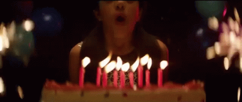 Blowing Candles Out Making A Wish GIF.