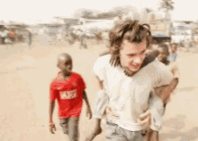 Harry Styles One Direction GIF - Harry Styles One Direction Piggy Back GIFs