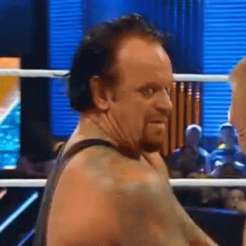 Undertaker Laughing Hysterically GIF.