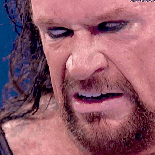 The Undertaker Rolls Eyes GIF - The Undertaker Rolls Eyes Smack D...