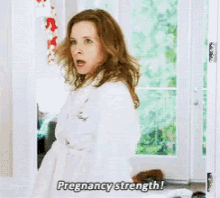 Playing House Pregnancy Strength GIF - Playing House Pregnancy Strength Pregnant GIFs