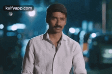 hand action dhanush serious looking tough