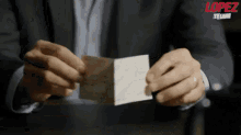 Check Reaction GIF - George Lopez Cheque Money GIFs