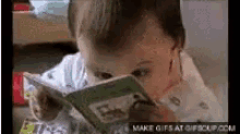 Cute Baby GIF - Cute Baby Trying To Study For Finals GIFs